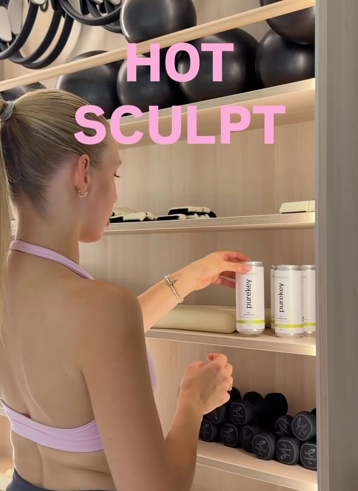 Purekey cans on a shelf in a pilates studio